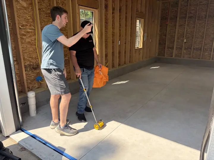 Measuring a garage floor with a measuring wheel